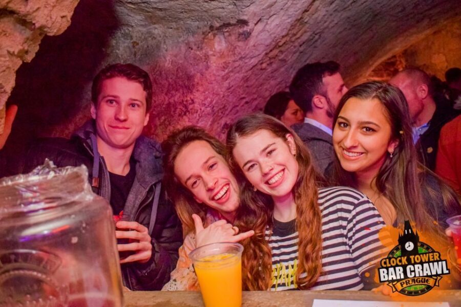 Prague: Clock Tower Bar Crawl with Drinks and Shots - The First Stop: Unlimited Beer and Mixed Drinks With Games